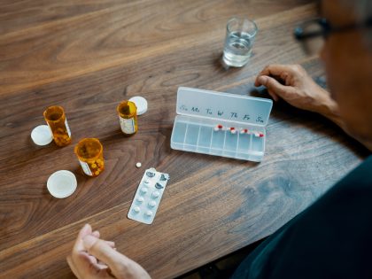 Senior man taking various medications