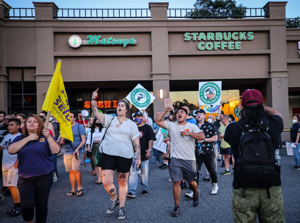 Protestors demonstrate outside Starbucks on Long Island in labor dispute