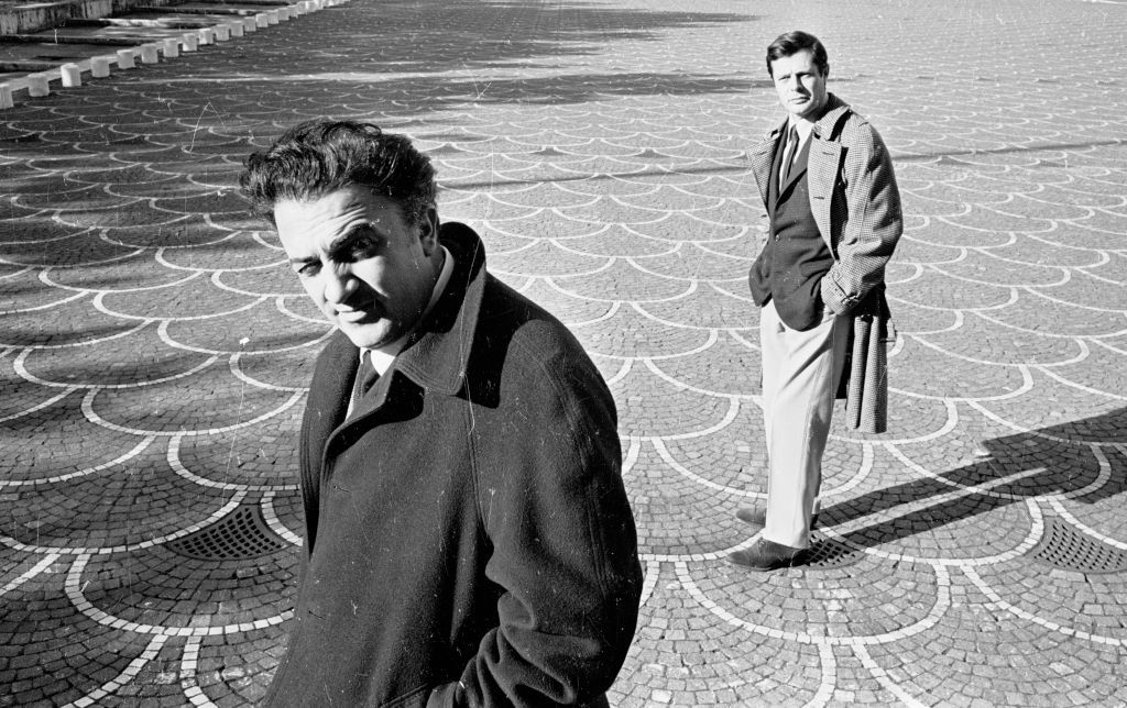 Film director Federico Fellini with actor Marcello Mastroianni in EUR Rome, 1962