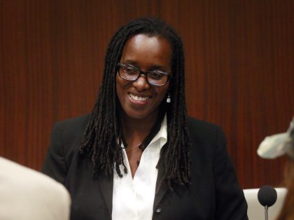 Vice Mayor Jovanka Beckles, center, speaks with supporters during a recess at the Richmond City Council meeting in Richmond, Calif., on Tuesday, July 15, 2014. Jovanka Beckles, a Richmond city councilmember who is a lesbian and native of Panama, has been