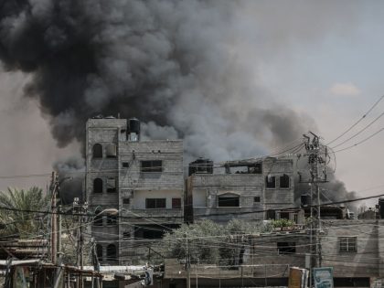 Smoke rises from shopping center following Israeli airstrike on Rafah