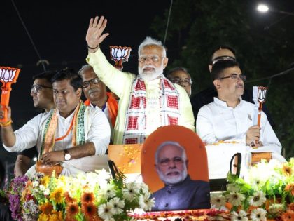 BJP Supporters Hold Modi Portrait Ahead of Kolkata Roadshow During Final Election Phase