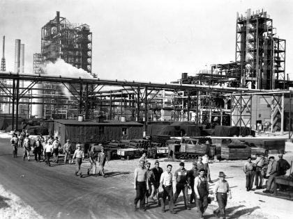 Workers in Front of Oil Refinery