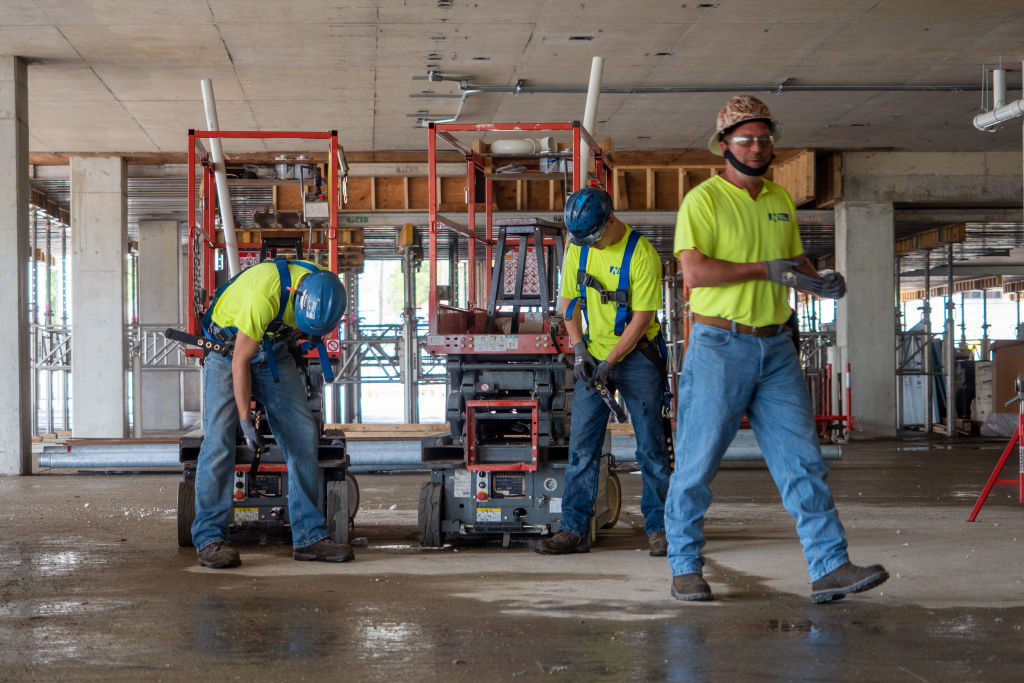 Plumbers Working On Construction Sites During Coronavirus COVID-19 Pandemic. Cincinnati, Ohio, USA