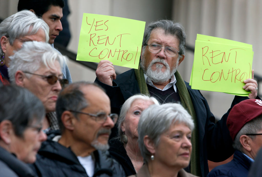 Juan Reardon and other tenants rights advocates protest in front of the Contra Costa County Courthouse before a hearing is held in Martinez, Calif. on Wednesday, Feb. 1, 2017. Richmond voters approved a rent control measure in November but a group of prop