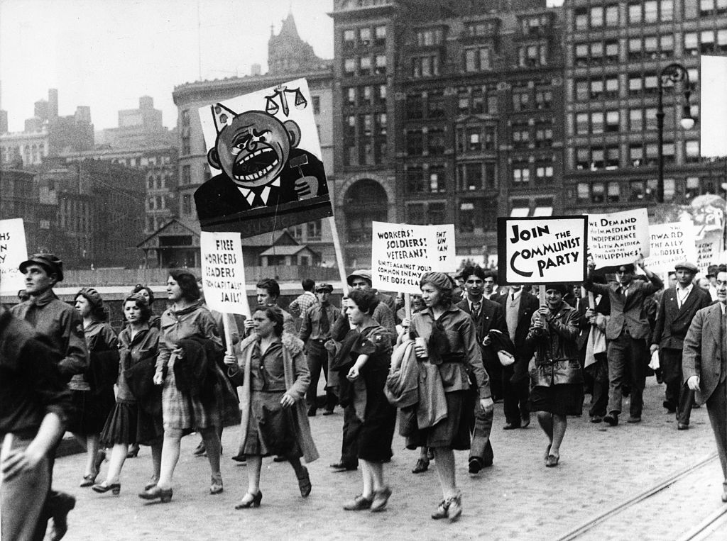 Women Carrying Signs in Communist Rally