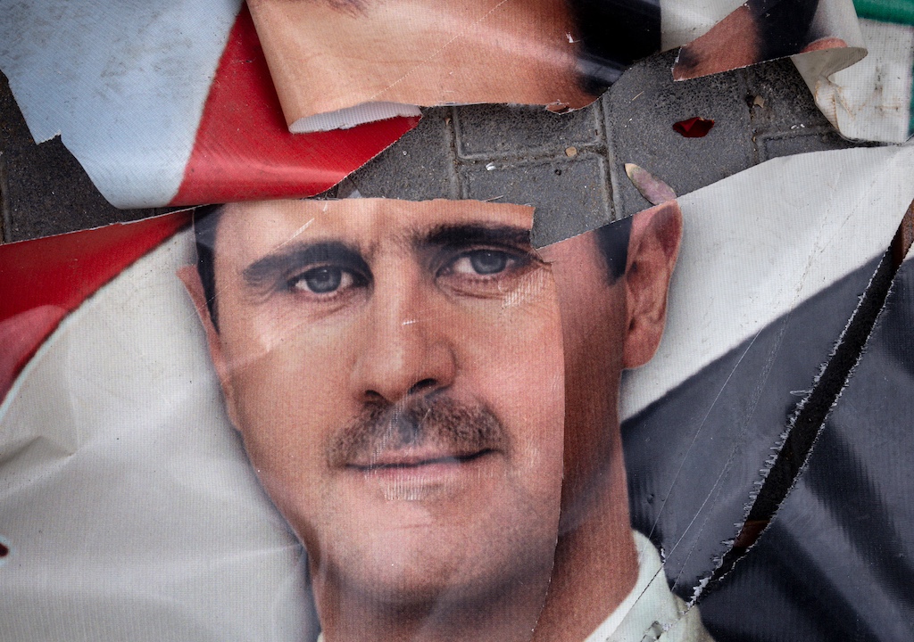 Assad Murals And Statues Defaced In Wake Of Regime's Overthrow