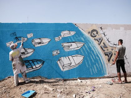 Palestinian artists create graffiti in support of Global Sumud Flotilla in Deir al-Balah