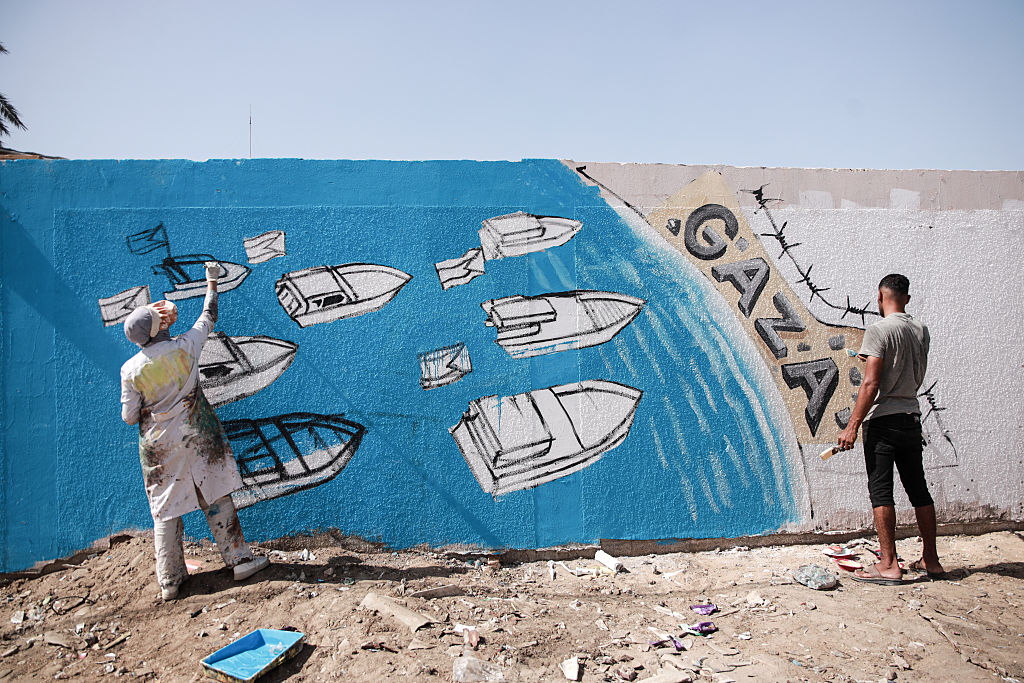 Palestinian artists create graffiti in support of Global Sumud Flotilla in Deir al-Balah