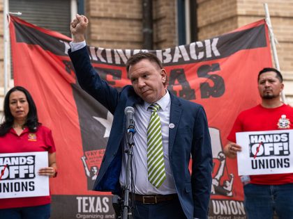 TXST rally - Tom Alter raises a fist