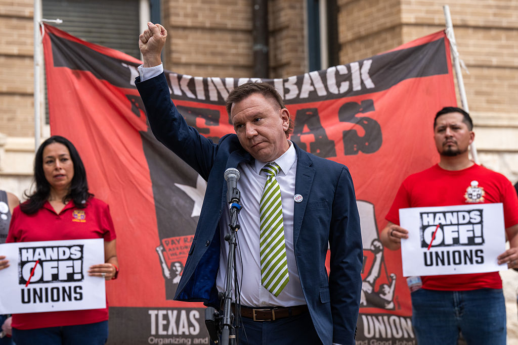 TXST rally - Tom Alter raises a fist