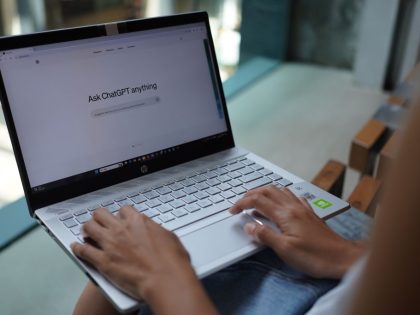 In this photo illustration, a woman browses OpenAi website