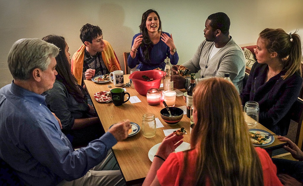 Georgetown univesity tudents and a professor meet for dinner and to get to know each other, in Washington, DC.