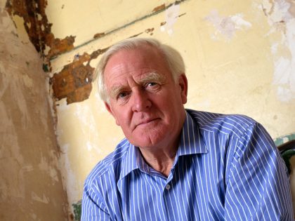 Writer John Le Carre at home