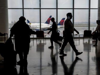 Travelers At SFO Airport Ahead Of Christmas Holiday