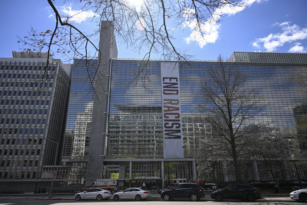 Poster hung reading "End Racism" in the World Bank building