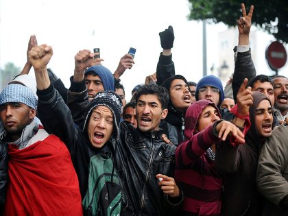 Tunisian students and teachers shout slo