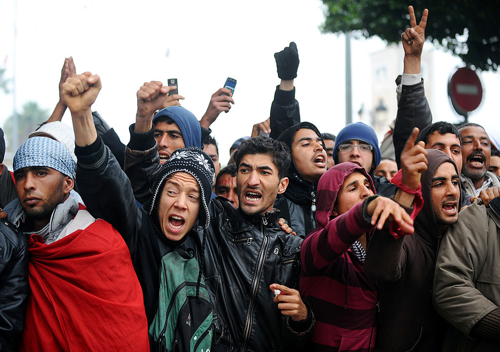 Tunisian students and teachers shout slo