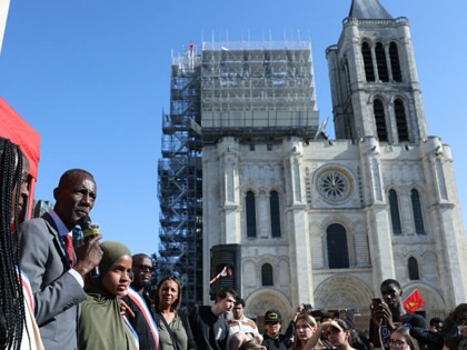 The mayor of Saint-Denis Bally Bagayoko addresses students near the cathedral in Saint-Denis.