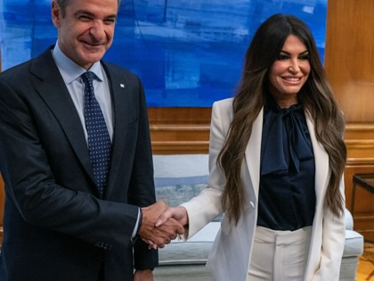 Greek Prime Minister Kyriakos Mitsotakis takes photos with US Ambassador to Greece Kimberly Guilfoyle prior to their meeting in Athens on November 5, 2025.
