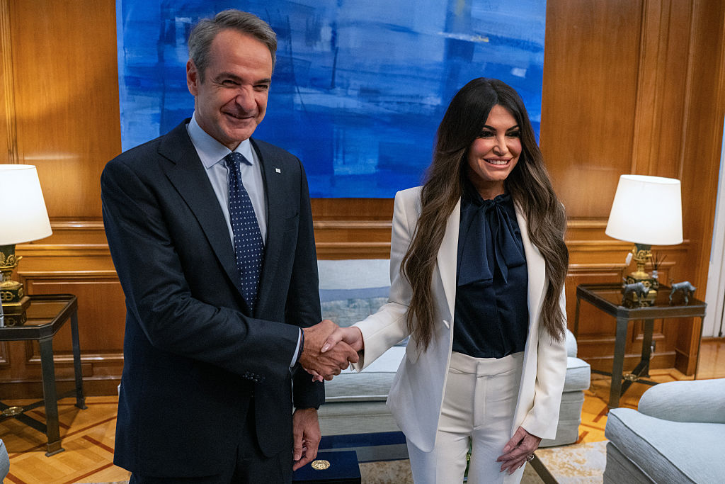 Greek Prime Minister Kyriakos Mitsotakis takes photos with US Ambassador to Greece Kimberly Guilfoyle prior to their meeting in Athens on November 5, 2025. 