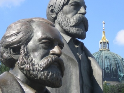 Statues of Karl Marx and Friedrich Engels photographed outside of the Marx-Engels Forum in Berlin.