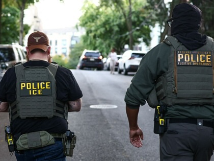 Federal agents walk near the scene where a man was shot by an Immigration and Customs Enforcement (ICE) officer during an operation in the Bronx borough of New York on October 8, 2026.