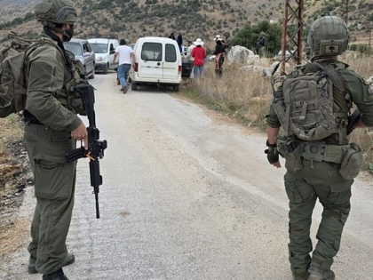 Lebanese farmers who want to enter their fields to harvest olives are blocked by Israeli soldiers in Kfar Shouba district of Nabatieh, Lebanon, on October 15, 2026.