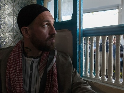 Fergie Chambers sits in a cafe in Tunis, on February 8, 2024.