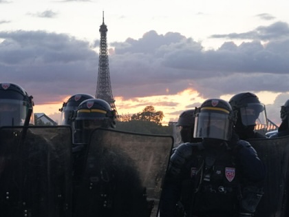Riot police march at a demonstration in Paris on October 17, 2026.