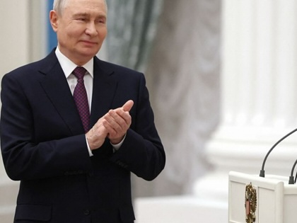 Russian President Vladimir Putin hosts a ceremony to present state awards to mentors and teachers of participants in Russia's military action in Ukraine, at the Kremlin in Moscow on October 5, 2026.