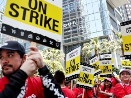Hotel workers with Unite Here Local 11 picket outside the InterContinental hotel on the first day of a strike by union members at many major hotels in Southern California on July 2, 2023, in Los Angeles, California.