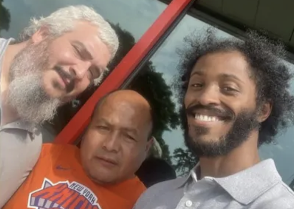 David Valencia, Juan Accostupa, and Nathan DuCongé take a photo together.