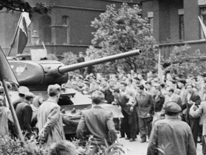 Striking Polish workers commandeer a Soviet tank amid the 1956 unrest in Poznań.
