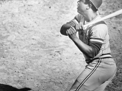Hank Aaron looks up after a hit in a 1975 game against the Boston Red Sox.