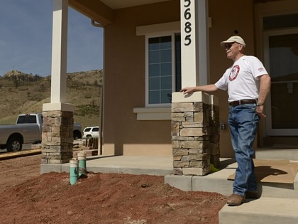  A homeowner outside his new home in the Mountain Shadows neighborhood in Colorado Springs, June 20, 2013. 