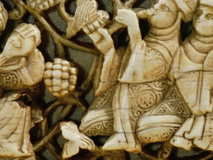 Carved ivory plaque from a piece of furniture, Detail depicting feasting with wine. Musicians entertain the feast. Egypt. Islamic. Fatimid period 11th to 12th century, AD.