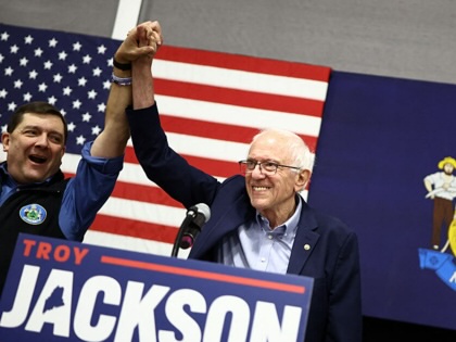 Democratic candidate for the US Senate Troy Jackson (L) is joined on the stage by US Senator from Vermont Bernie Sanders during his campaign rally in Biddeford, Maine, on October 11, 2026.