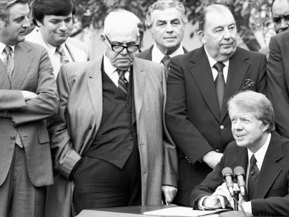 Carter Signs Minimum Wage Bill