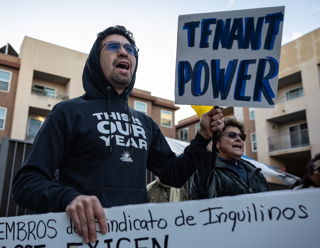 Councilwoman Eunisses Hernandez gathers at an apartment complex in Lincoln Heights with residents and activist as they protest poor living conditions in several apartment communities in the area