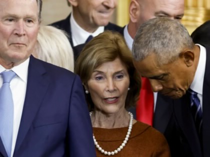 Former US President George W. Bush, former First Lady Laura Bush, and former US President Barack Obama speak after the inauguration of President Donald Trump in the US Capitol Rotunda on January 20, 2025, in Washington, DC.