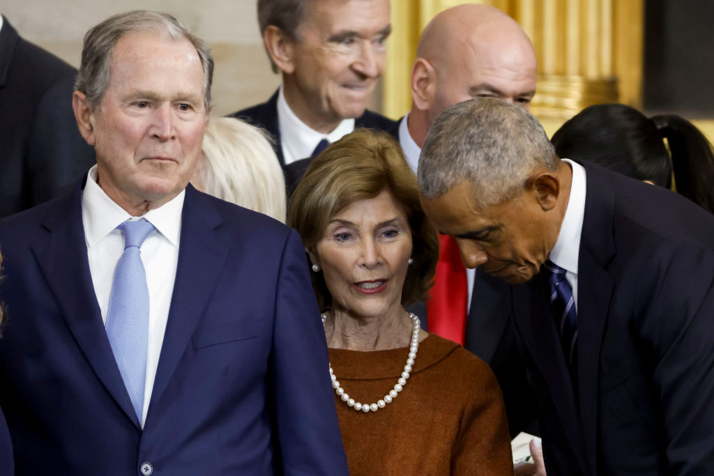 Former US President George W. Bush, former First Lady Laura Bush, and former US President Barack Obama speak after the inauguration of President Donald Trump in the US Capitol Rotunda on January 20, 2025, in Washington, DC.
