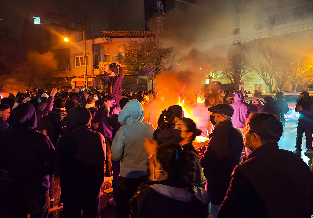 Fires are lit as protesters rally on January 8, 2026, in Tehran, Iran.