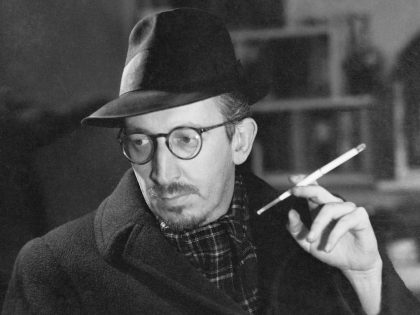 Dwight MacDonald Smoking a Cigarette
