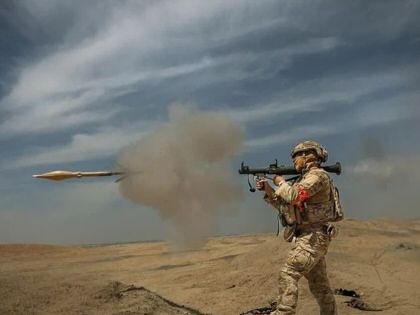 A member of the Islamic Revolutionary Guard Corps participates in a military exercise aimed at "increasing combat capabilities" in Tehran province, Iran, on May 12, 2026.