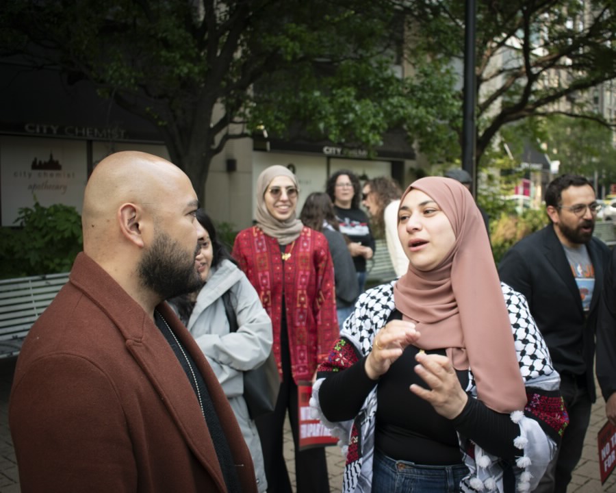 Steven Raga and Aber Kawas attend a press conference in Queens.