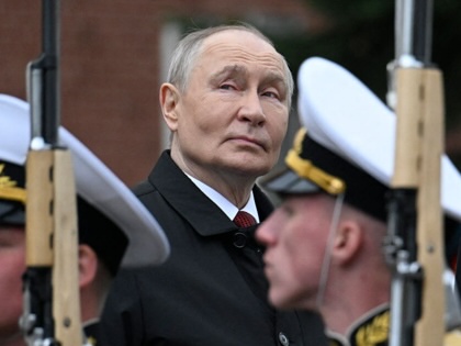 Russian President Vladimir Putin attends a ceremony to lay flowers at the Tomb of the Unknown Soldier by the Kremlin wall in central Moscow on May 9, 2026.