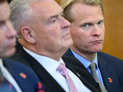Reform UK Chairman David Bull (left) and Reform UK MP for Ashfield Lee Anderson (center) and Reform UK advisor James Orr (right) listen as former Conservative MP Danny Kruger addresses the media during a Reform UK press conference on October 28, 2025, in London, England.