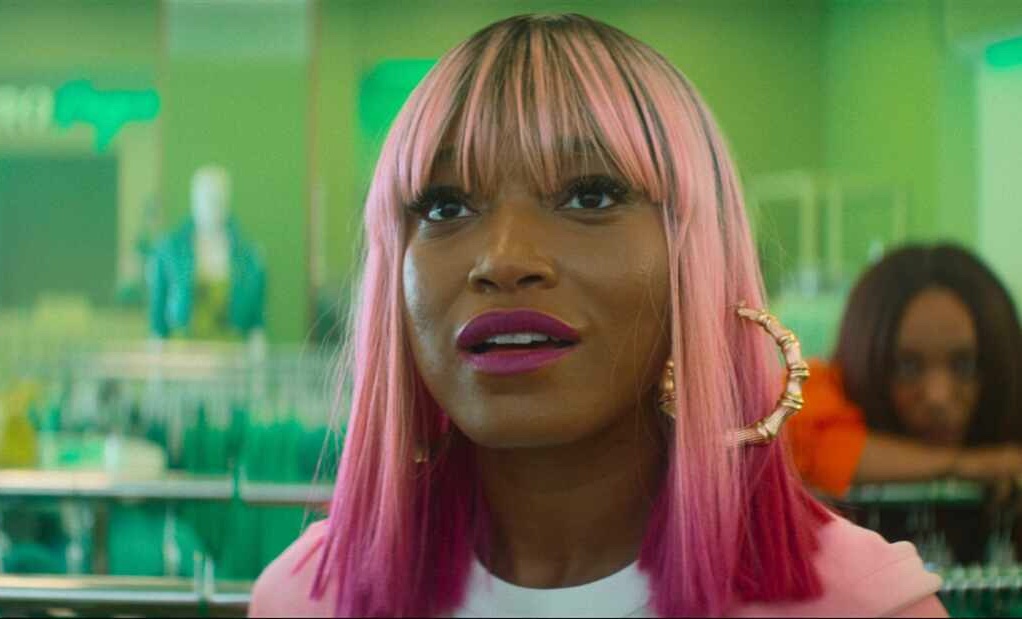 Close up still on actress Keke Palmer as Corvette with pink hair.