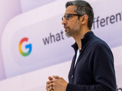 Google CEO Sundar Pichai speaking with the Google icon and search bar in the background.